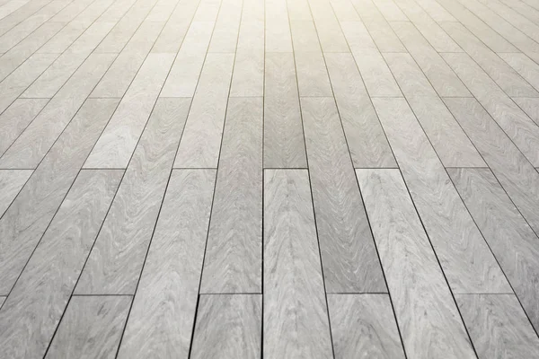 The surface with elongated rectangular stone tiles of gray color goes into perspective. — Stock Photo, Image