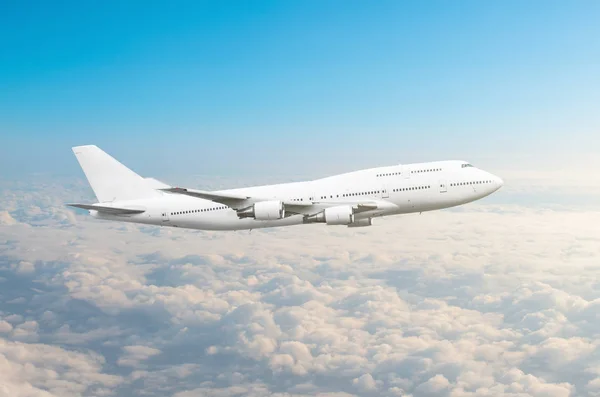 Two-story airplane in the sky above the clouds flight journey sun height. — Stock Photo, Image