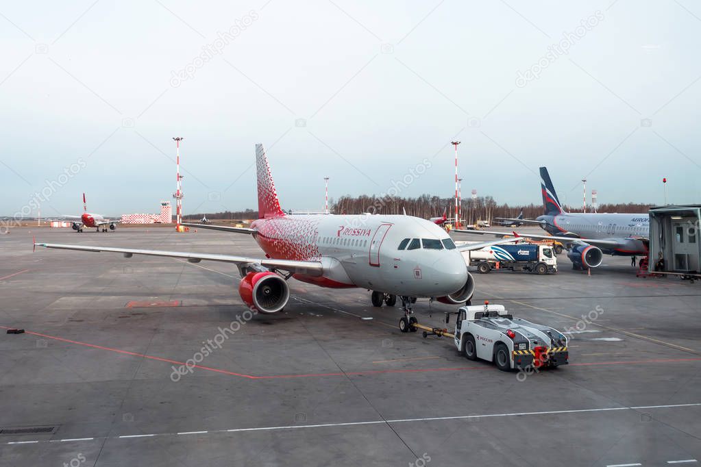 Airbus a-319 push back tow Rossiya Russian Airlines. Russia, Saint-Petersburg, airport Pulkovo. 20 April 2018.