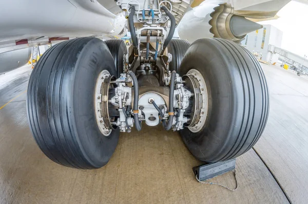Wheels rubber tire rear landing gear racks, under wing view.