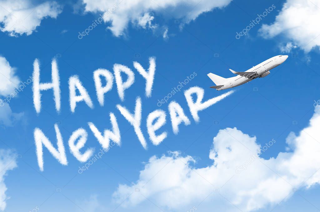 The plane flies in the clouds leaving the inscription - Happy New Year.