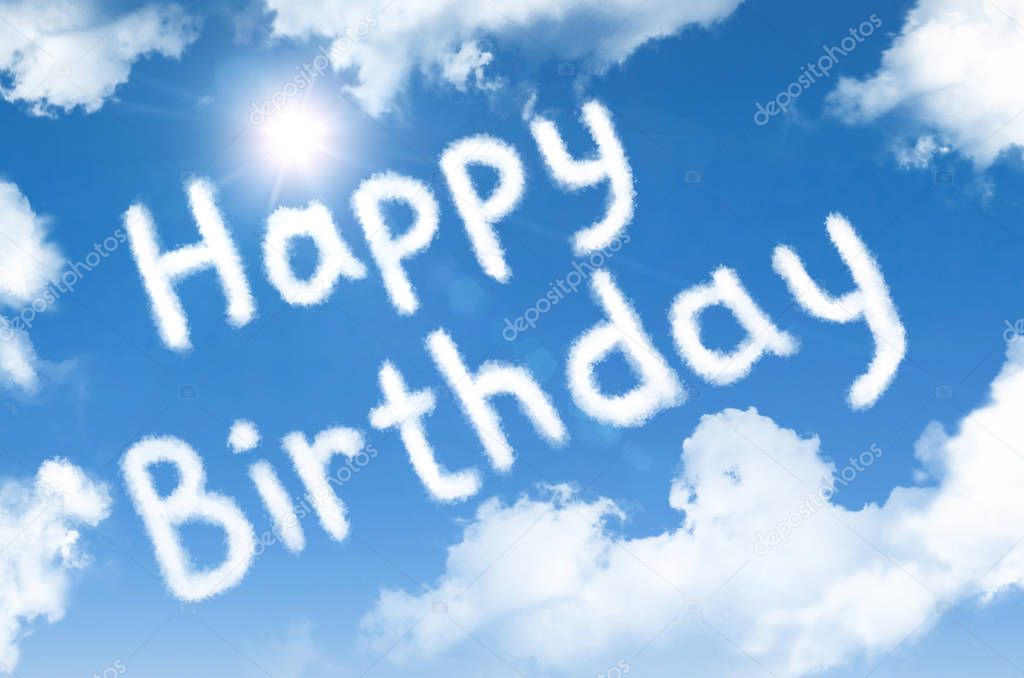 Happy birthday cloud words in the sky with a bright sun.