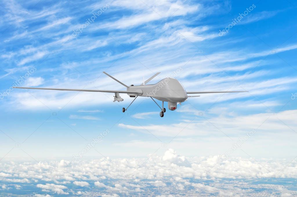 Military uav drone flight flies above the clouds.