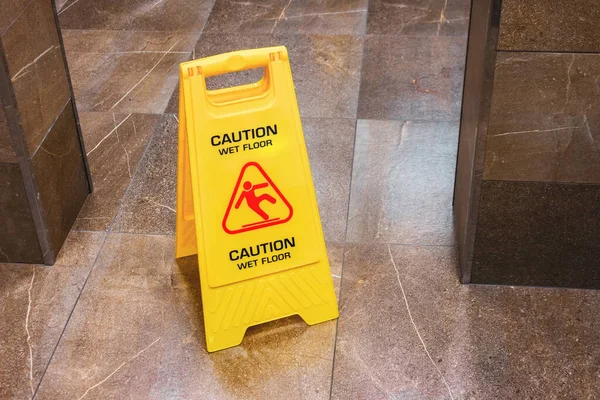 Yellow Sign Caution Wet Floor Falling Man Hallway Public Toilet — Stock Photo, Image