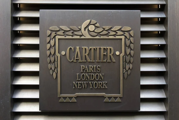 Word cartier op een muur in amsterdam — Stockfoto