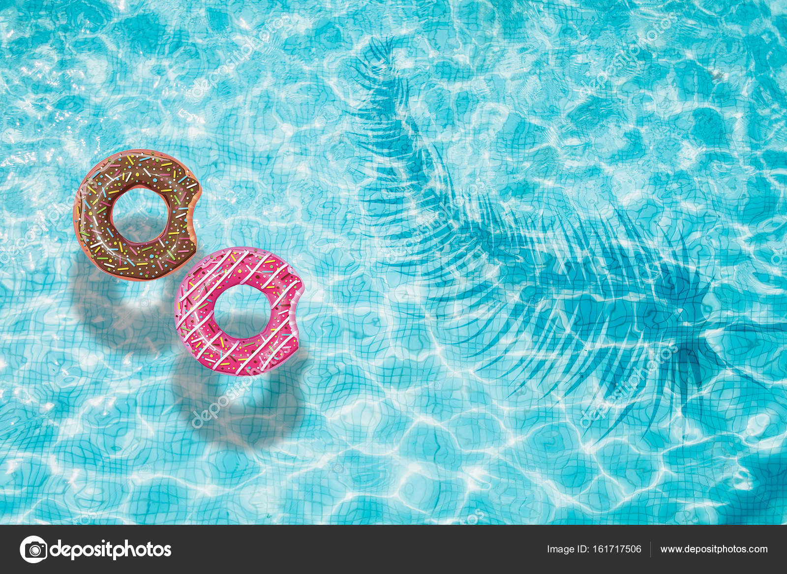 Blue swimming pool with rings floating — Stock Photo © AlexanderMils
