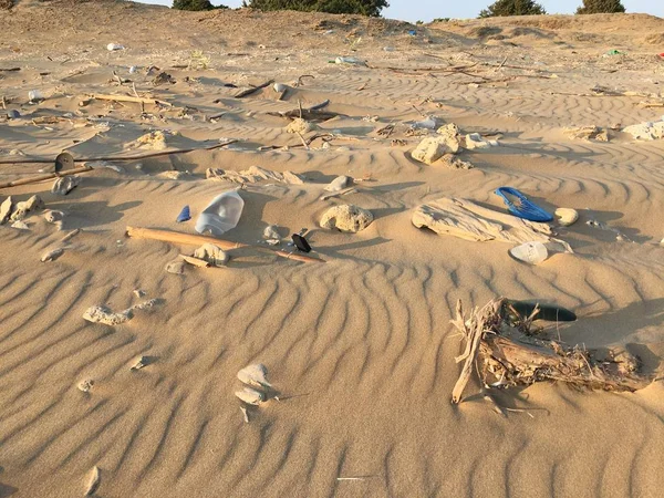 Garbage on sandy beach