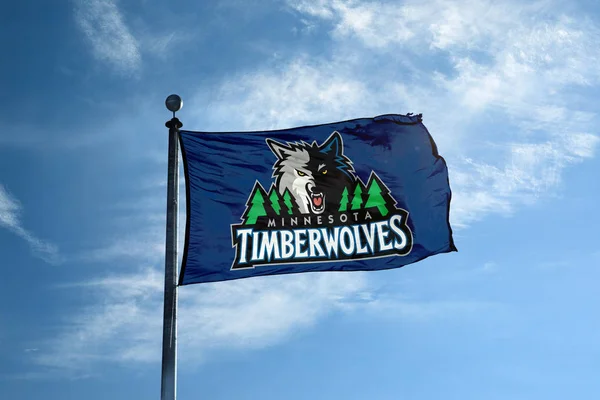 MINNESOTA - October 24, 2017 - Waving flag on the mast with Minnesota Timberwolves NBA basketball team logo, United States. — Stock Photo, Image