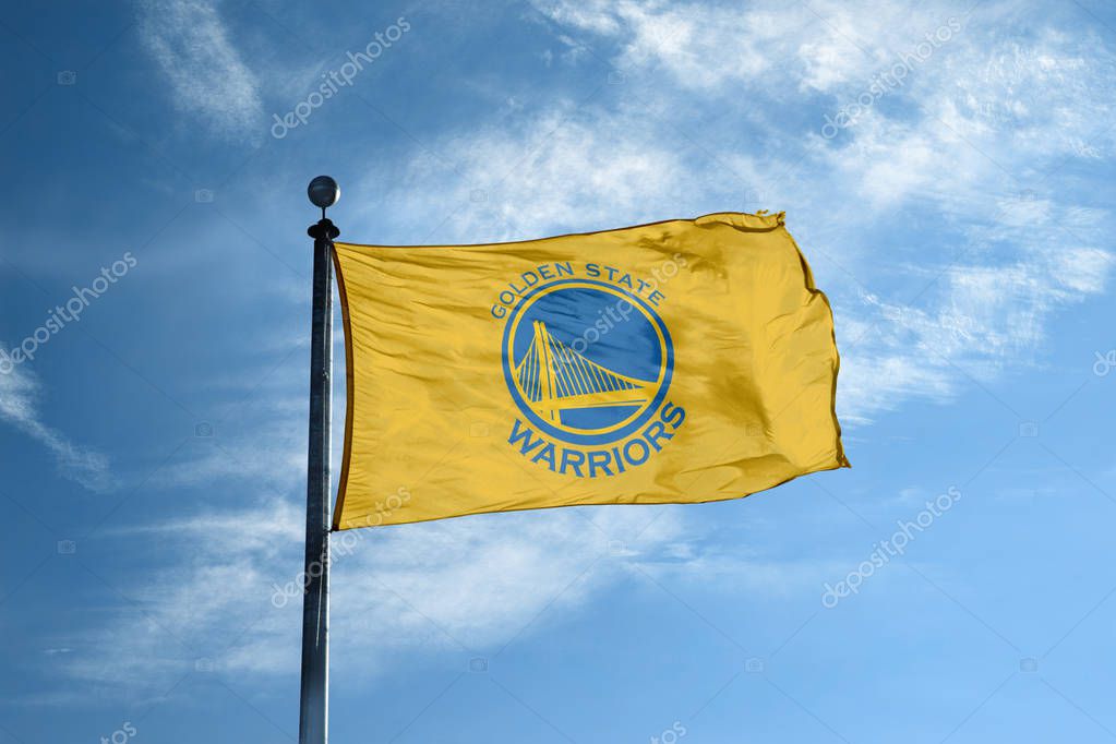 OAKLAND - October 24, 2017 - Waving flag on the mast with Golden State Warriors NBA basketball team logo, United States.