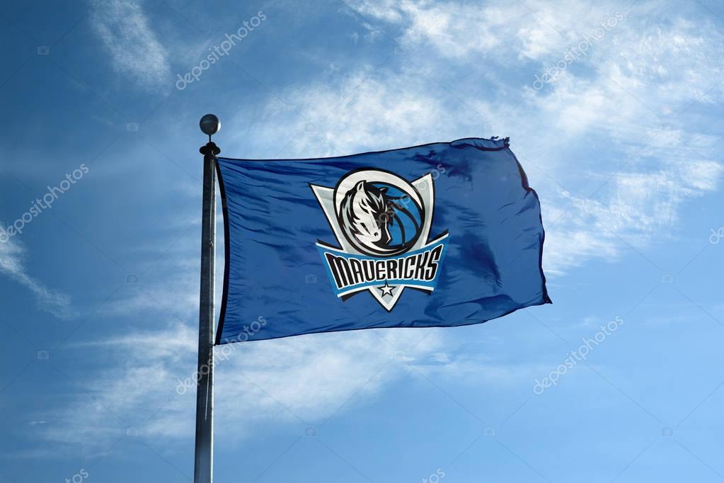 DALLAS - October 24, 2017 - Waving flag on the mast with Dallas Mavericks NBA basketball team logo, United States.