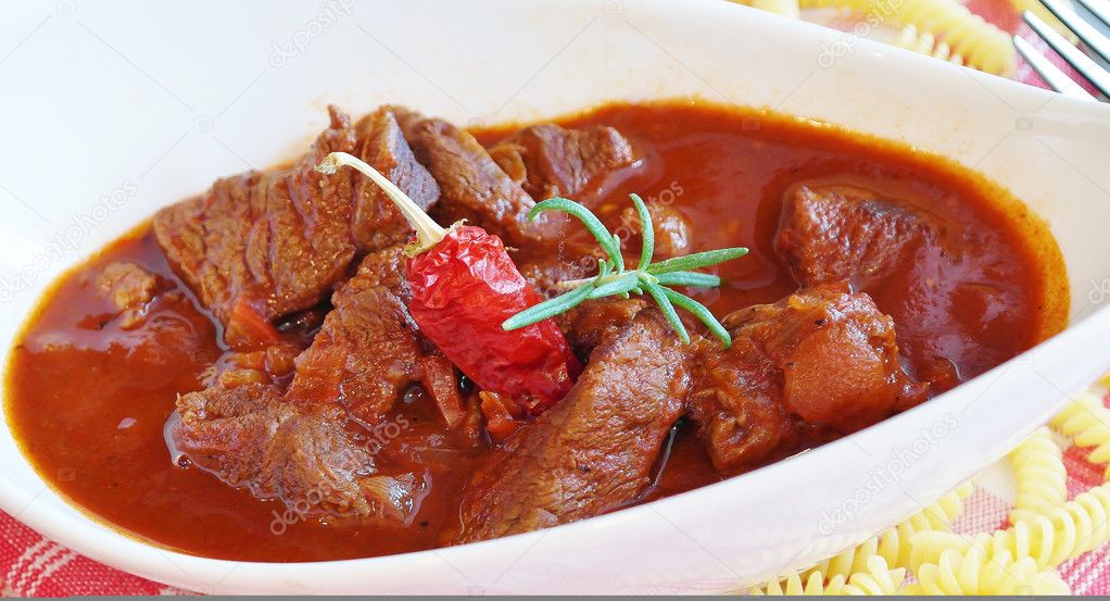 White plate with goulash