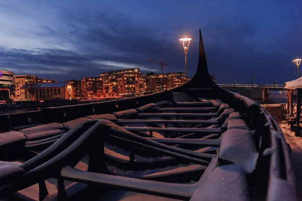 Replica of old viking boat covered with snow during Christmas time. Tonsberg, Norway.