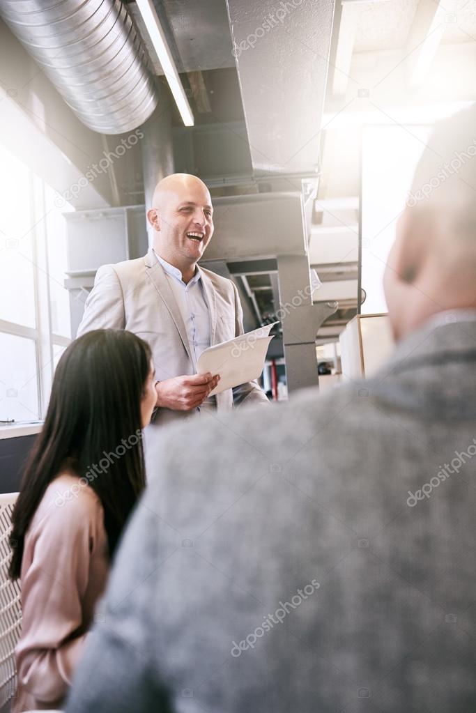 Portrait image of professional businessman giving a presentation to peers