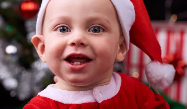 Close up of cute baby wearing a santa claus hat Stock Image