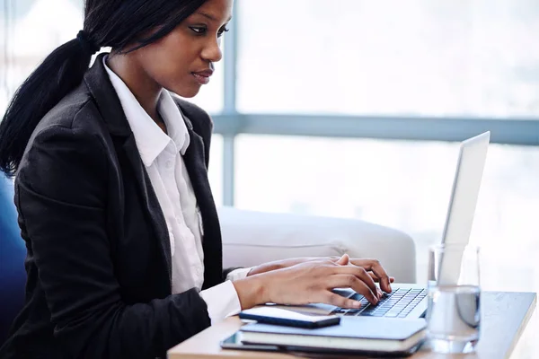 African business woman busy working in a corporate business lounge — Stock Photo, Image