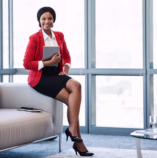 Square image of businesswoman smiling at camera in businesslounge — Stock Photo, Image