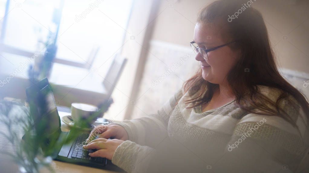 Spy like image of chubby girl in a bright cafe