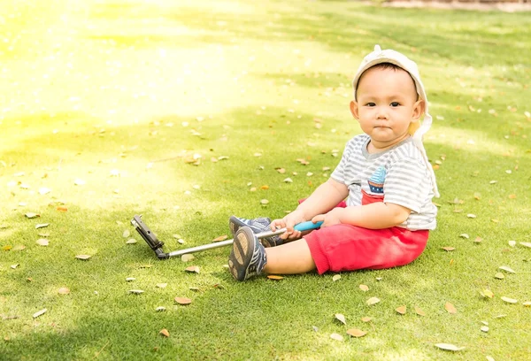 Asian baby taking selfie photo on the green grass field in the p — Stock Photo, Image