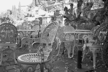 Winter pub chairs. Black and white photo