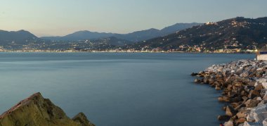 Panoramic view of the seashores of Sestri Levante, Ligurian Sea, Northern Italy); in the background, the lights of Chiavari and Lavagna (both Genoa Province, Liguria).