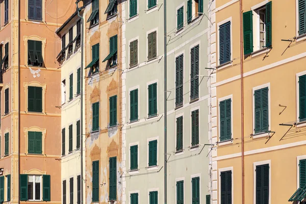 Group of palaces facades of Camogli, painted with famous pastel colors. Camogli is a small fisherman village on the shores of the Ligurian Sea. (Northern Italy); during summertime became full of tourists, coming from all Italy and abroad.