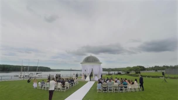 Wedding venue outdoors with people time lapse guests gathering and ceremony taking place. Wedding decoration wedding planner event organization getting married registry outdoors fast day stop motion — Stock Video