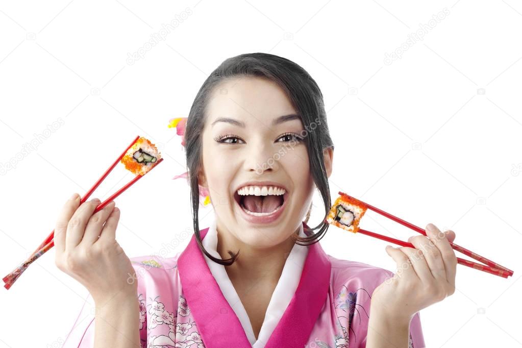 Beautiful Woman Holding Sushi with Two Pairs of Chopsticks