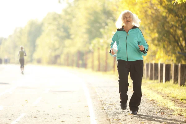Senior Woman Jogging Outdoors — Stock Photo, Image