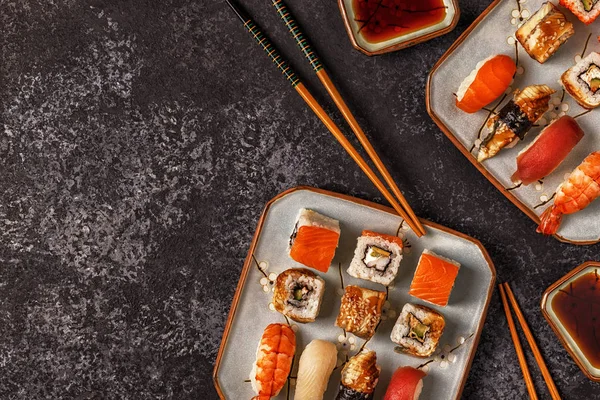 Sushi Set: sushi and sushi rolls on plate.