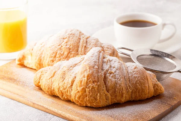 Continental breakfast with fresh croissants, orange juice and co