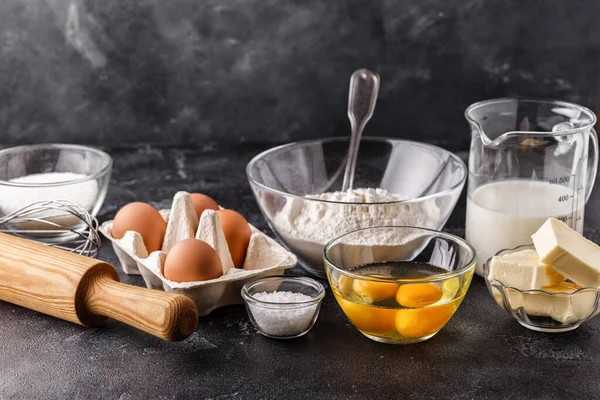 Bakery products -flour, eggs, milk. Selective focus, copy space.
