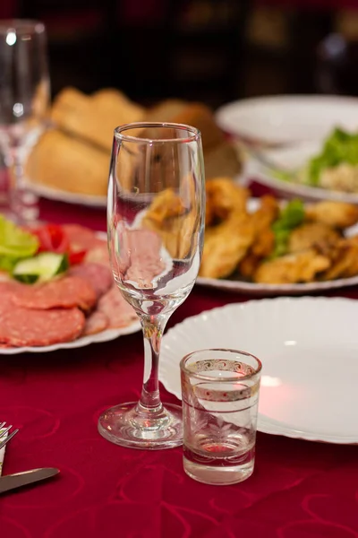 Champagne glass on the table with food