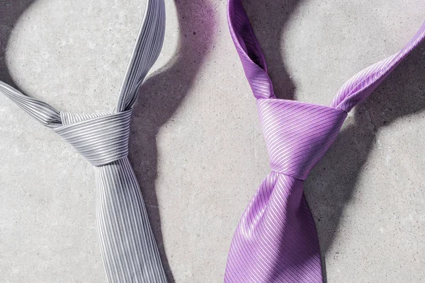 Elegant neckties on gray stone background — Stock Photo, Image