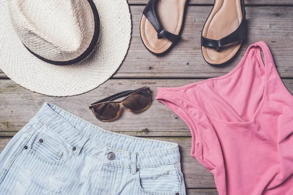 Casual woman clothes on wooden table — Stock Photo, Image