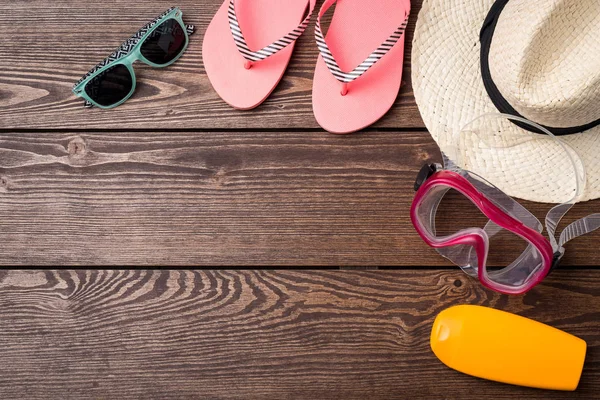 Summer or beach accessories on wooden table. — Stock Photo, Image