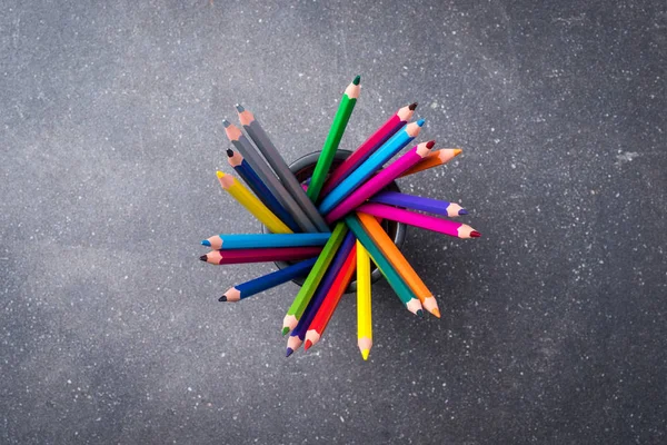 Bunch of colorful pencils on gray stone background — Stock Photo, Image