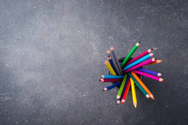 Bunch of colorful pencils on gray stone background — Stock Photo, Image