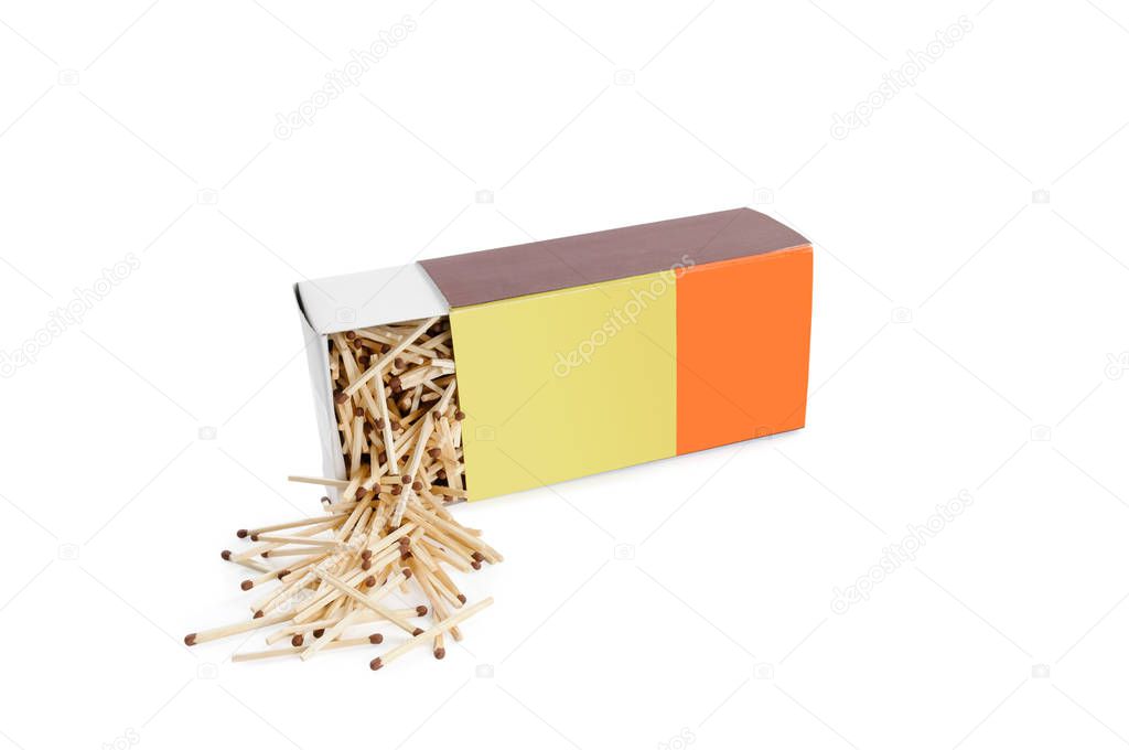 Big half open recumbent matchbox filled with matches on white ba