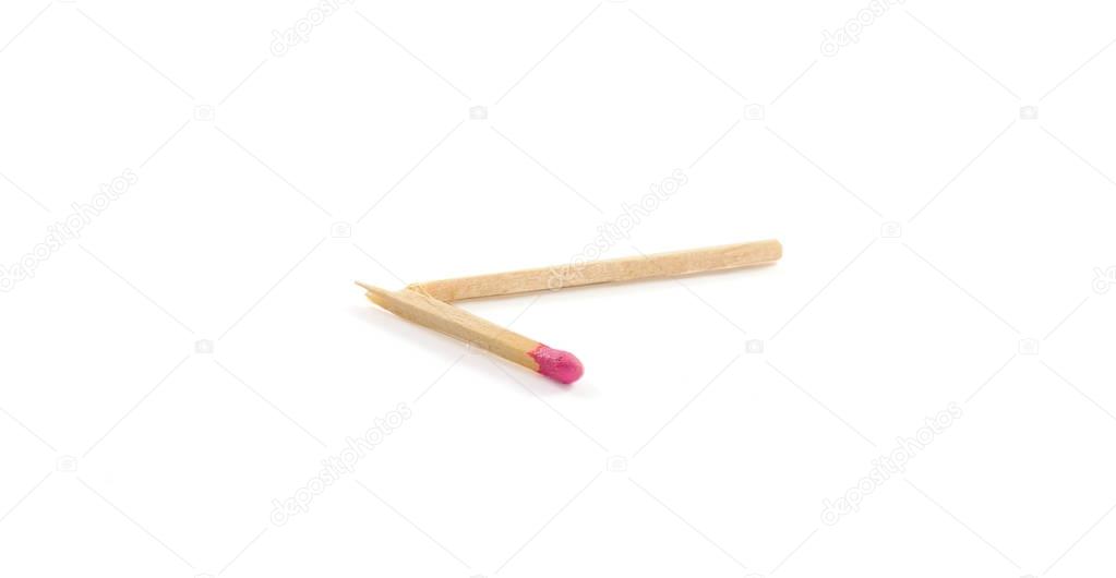 Lone broken match with rose match head on white background