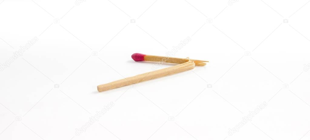 One broken match with rose match head on white background