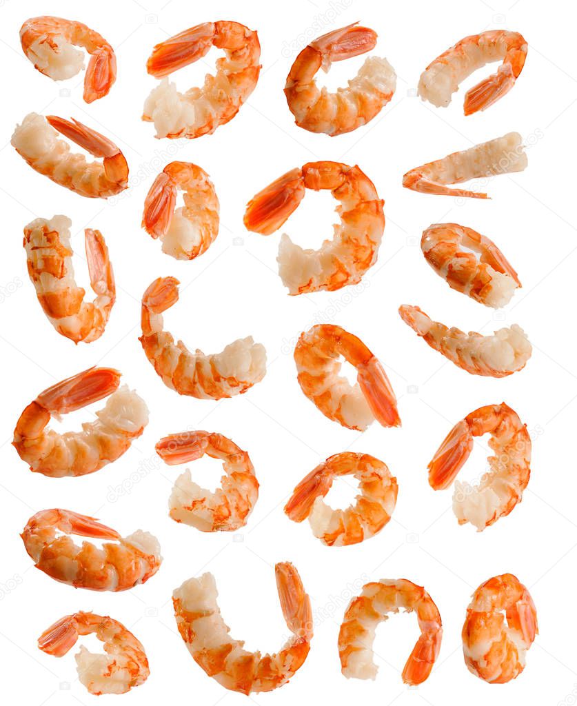 Many big cooked peeled shrimps at various angles on white backgr