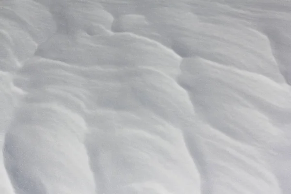 Schneehintergrund auf einer gefrorenen Flussoberfläche im Winter — Stockfoto