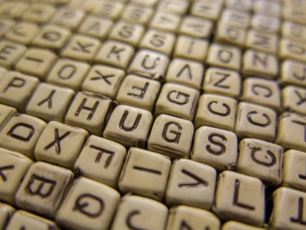 Φόντο Κατασκευασμένα Από Ξύλινα Κύβοι Γράμματα Σχηματίζοντας Λέξη Αγκαλιά — Φωτογραφία Αρχείου