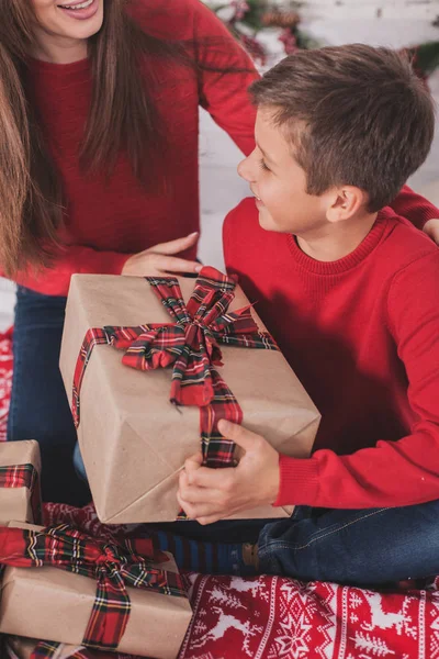 Girl and child new year with presents in hands — Stock Photo, Image