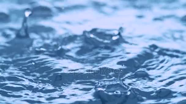 Waterdrop Hits Agitated Water Surface Slow Motion — Stock Video