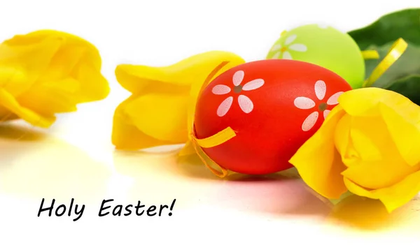 Easter colorful eggs with yellow tulips — Stock Photo, Image