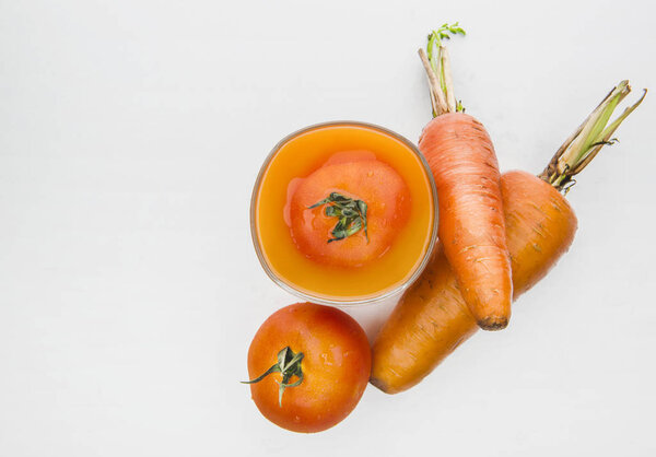 Fruit and fruit juices are on a white background.