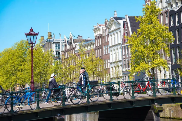 View of the ancient buildings, streets, people, embankments of Amsterdam, The Netherland — Stock Photo, Image