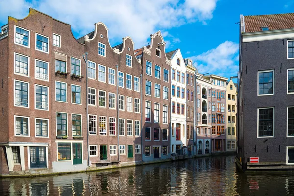 Traditional dutch medieval buildings on the water, Amsterdam.