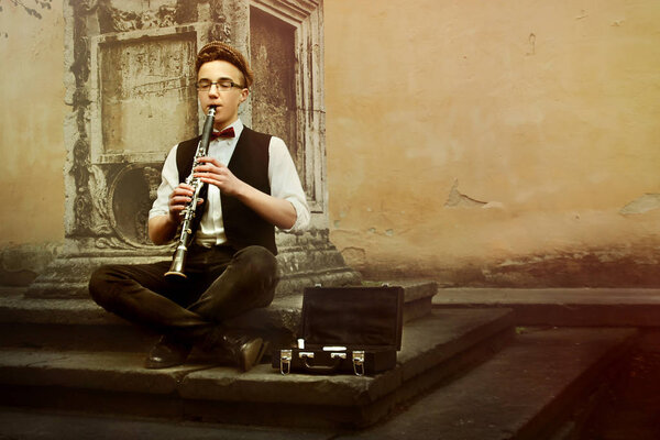hipster playing clarinet  